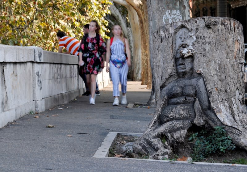 Andrea Gandini's sculputure from a dead tree stump is displayed in Rome