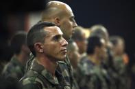 A French soldier listens to French President Francois Hollande's speech in Bangui December 10, 2013. Hollande flew into Central African Republic hours after two French soldiers were killed in fighting and praised his troops for tackling "horrendous violence" against women and children and helping avert a slide into civil war. Picture taken December 10, 2013. REUTERS/Emmanuel Braun (CENTRAL AFRICAN REPUBLIC - Tags: CIVIL UNREST MILITARY POLITICS CONFLICT)