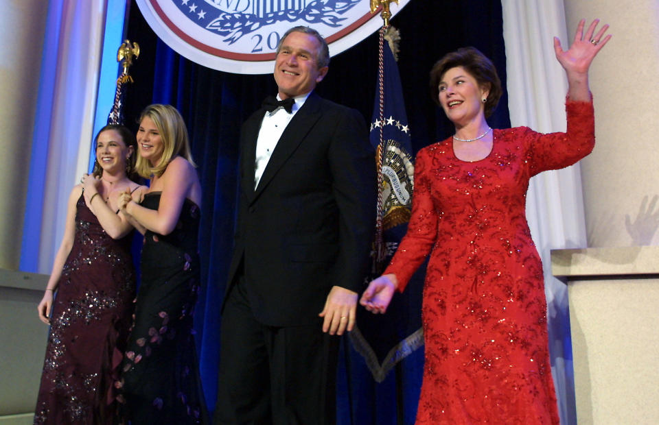 United States President George W. Bush (C), his wife Laura, and daughters Jenna and Barbara, attend the first inaugural ball in Washington, DC.&nbsp; (Photo: Brooks Kraft via Getty Images)