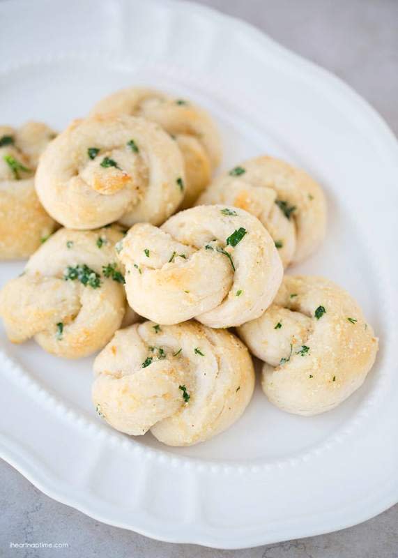 <p>I Heart Naptime</p><p>These rolls come together in 20 minutes!</p><p><strong>Get the recipe: </strong><a href="https://www.iheartnaptime.net/easy-garlic-parmesan-knots/" rel="nofollow noopener" target="_blank" data-ylk="slk:Garlic Parmesan Knots;elm:context_link;itc:0;sec:content-canvas" class="link rapid-noclick-resp"><strong>Garlic Parmesan Knots</strong></a></p>