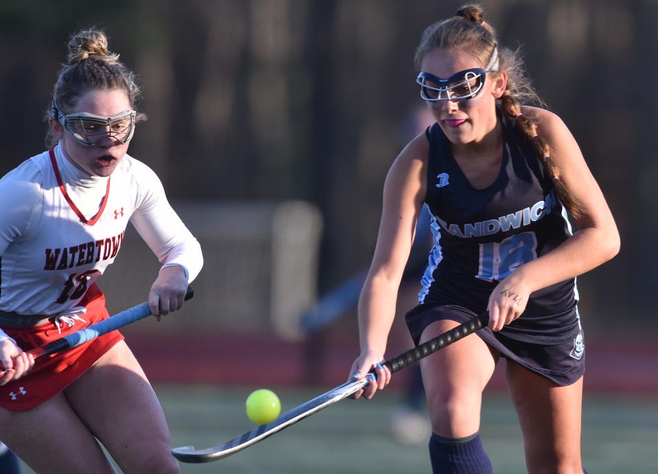 NORWELL 11/19/22  Sandwich's Alivia Barnes knocks down an airball as Watertown's Maggie Driscoll moves in at left.  Sandwich was shut out by Watertown 2-0 in the girls field hockey Div. 3 state final match played at Norwell HS on Saturday. Cape Cod Times/Steve Heaslip