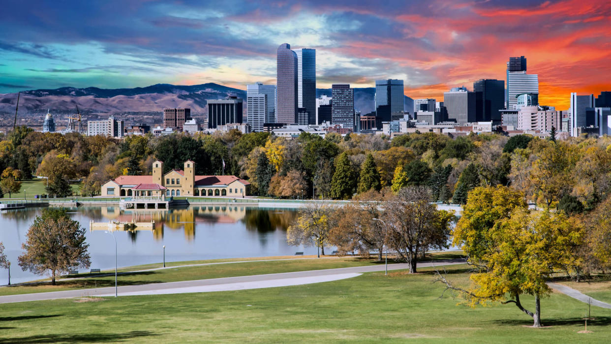 Denver skyline across city park in autumn.