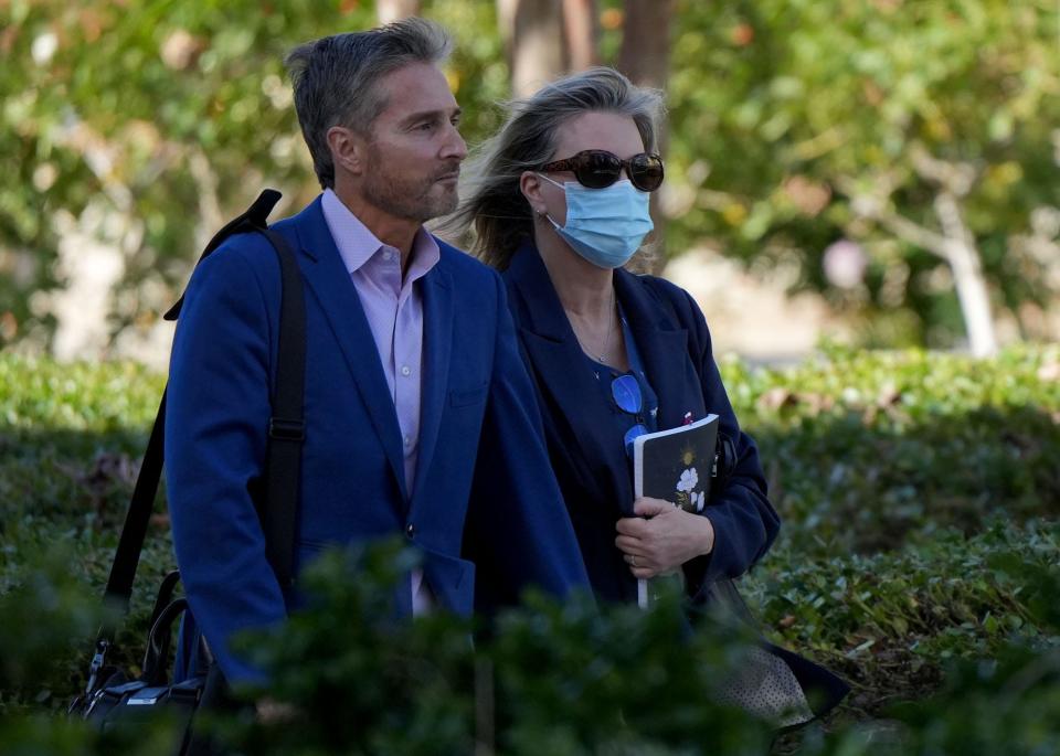 Dr. Peter Grossman walks with his wife, Rebecca Grossman, to a Van Nuys courthouse in January.