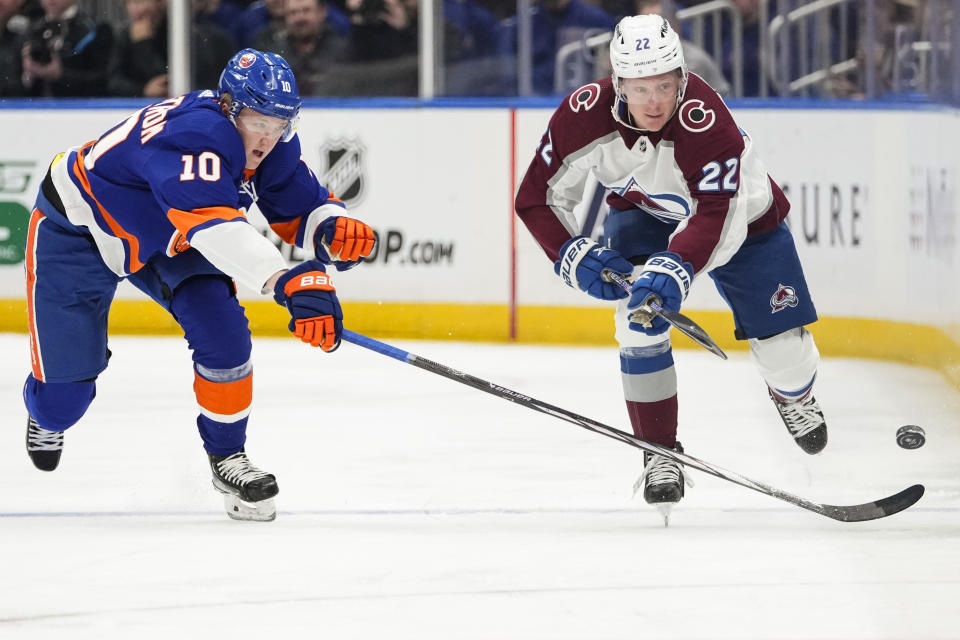 New York Islanders' Simon Holmstrom (10) defends against Colorado Avalanche's Fredrik Olofsson (22) during the first period of an NHL hockey game Tuesday, Oct. 24, 2023, in Elmont, N.Y. (AP Photo/Frank Franklin II)