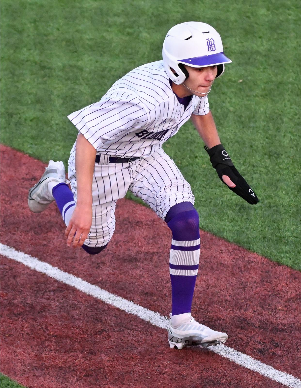Bloomington South’s Reid Walker heads home to score the game-winning run during the baseball game against Bloomington North at South on Thursday, April 25, 2024.