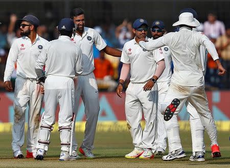 Cricket - India v New Zealand - Third Test cricket match - Holkar Cricket Stadium, Indore, India - 10/10/2016. India's Ravichandran Ashwin celebrates with teammates after the wicket of New Zealand's James Neesham. REUTERS/Danish Siddiqui