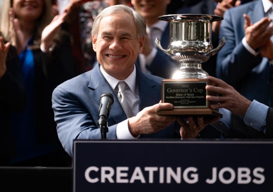 Gov. Greg Abbott accepts Texas' 13th Governor's Cup, awarded by Site Selection Magazine, during a press conference Wednesday. Abbott spoke about Texas' recent economic growth and the lawmaking that he says contributed to that growth.