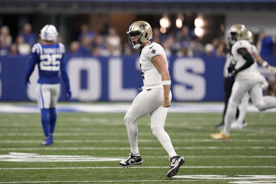 New Orleans Saints quarterback Derek Carr (4) celebrates a first down against the Indianapolis Colts during the second half of an NFL football game Sunday, Oct. 29, 2023 in Indianapolis. (AP Photo/Michael Conroy)