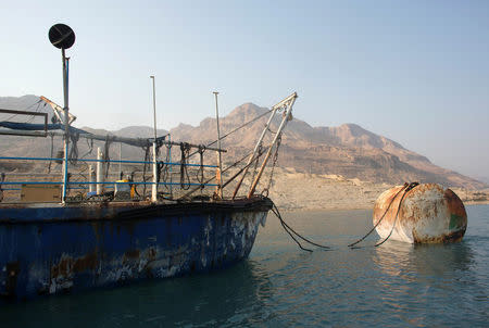 A research boat is seen on the dead sea while environmental activists take part in "The Dead Sea Swim Challenge", swimming from the Jordanian to Israeli shore, to draw attention to the ecological threats facing the Dead Sea, in Kibbutz Ein Gedi, Israel November 15, 2016. REUTERS/Nir Elias