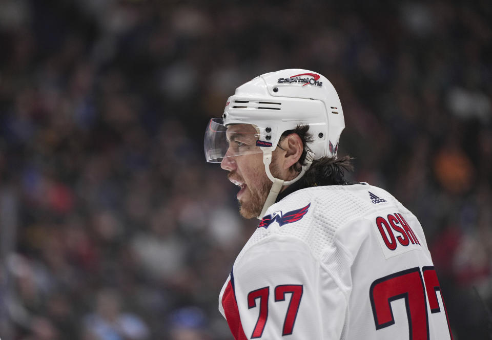 Washington Capitals' T.J. Oshie looks on during a stoppage while playing in his 1,000th career game, during the first period of an NHL hockey game against the Vancouver Canucks, in Vancouver, British Columbia, Saturday, March 16, 2024. (Darryl Dyck/The Canadian Press via AP)