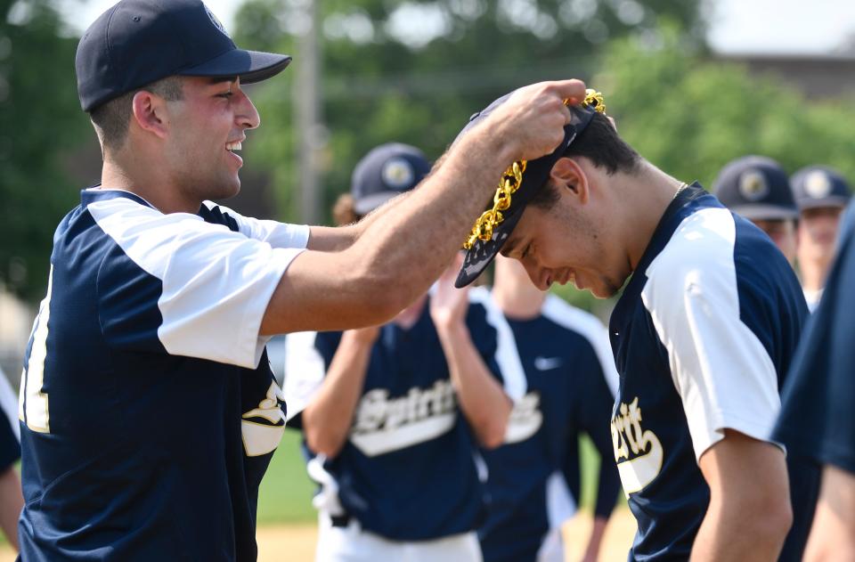 Holy Spirit's Trevor Cohen (7) is awarded the game necklace following Wednesday's 8-5 playoff win over St. Joseph Academy in Hammonton. June 1, 2022.
