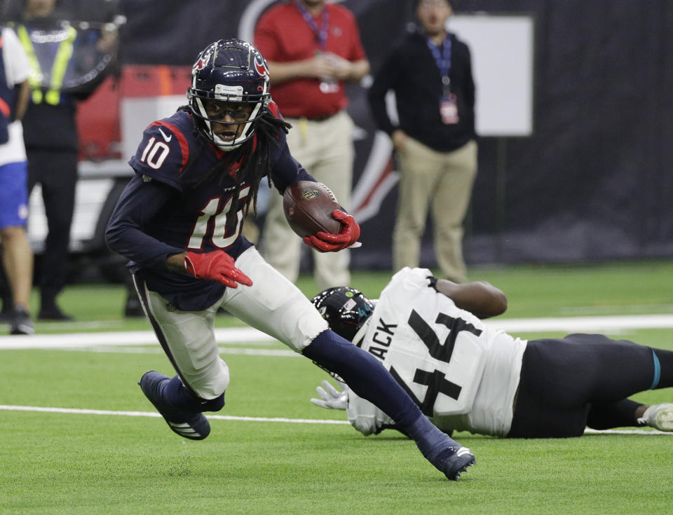 FILE - In this Dec. 30, 2018, file photo, Houston Texans wide receiver DeAndre Hopkins (10) runs past Jacksonville Jaguars middle linebacker Myles Jack (44) after making a catch during the first half of an NFL football game in Houston. The Texans have placed Hopkins on the physically unable to perform list. (AP Photo/David J. Phillip, File)