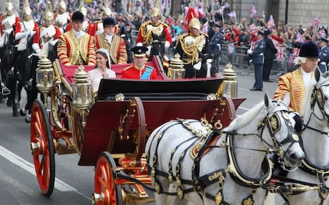 The Duke and Duchess of Cambridge during their wedding carriage procession in 2011 - Credit: Matt Cardy/AP