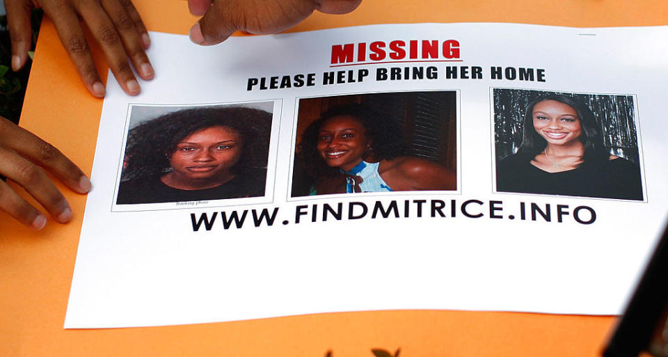 A missing person sign with photos of Mitrice