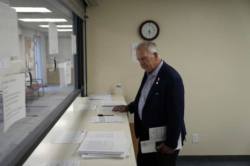 Interim Nye County Clerk Mark Kampf works in an office where early votes are being counted Wednesday, Oct. 26, 2022, in Pahrump, Nev. Ballot counting began in the county where officials citing concerns about voting machine conspiracy theories pressed forward with an unprecedented hand tally of votes cast by mail in advance of Election Day. (AP Photo/John Locher)