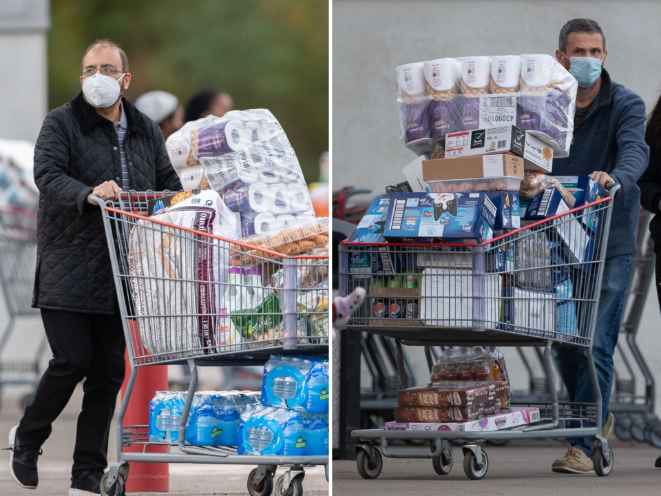 <p>Two shoppers leave Costco on Saturday as Boris Johnson prepared to announce a second lockdown</p> (Joe Giddens/PA Wire)