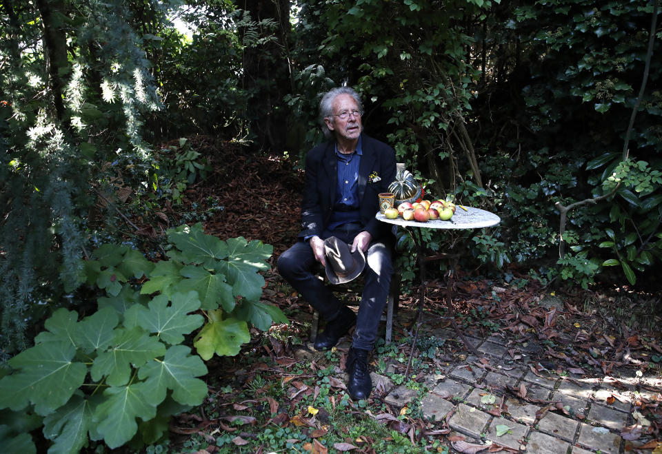 Austrian author Peter Handke poses for a photo in his garden at his house in Chaville near Paris, Thursday, Oct. 10, 2019. Handke was awarded the 2019 Nobel Prize in literature earlier Thursday. (AP Photo/Francois Mori)