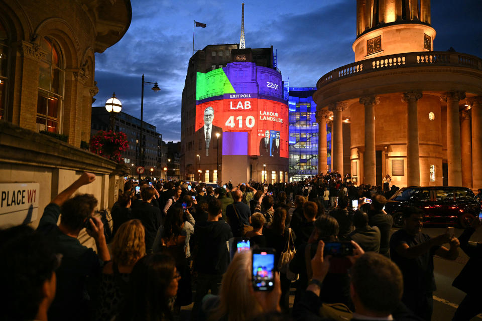An exit poll predicting that the Labour Party led by Keir Starmer will win 410 seats in Britain’s general election is projected onto BBC Broadcasting House in London. Image: OLI SCARFF/AFP via Getty Images.