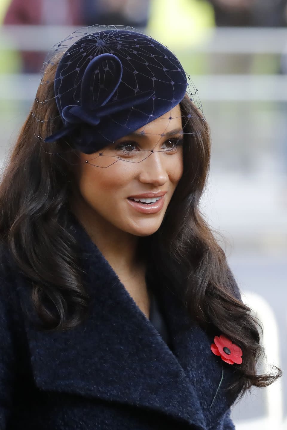 Meghan with Hollywood waves and a navy velvet fascinator at the 91st Field Of Remembrance ceremony, 2019