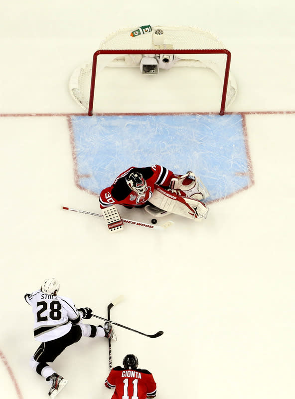  Martin Brodeur #30 Of The New Jersey Devils Makes A Save In Front Of Jarret Stoll #28 Of The Los Angeles Kings And Getty Images