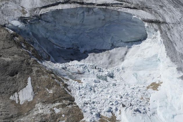 A view taken from a rescue helicopter of the Punta Rocca glacier near Canazei, in the Italian Alps in northern Italy on July 5 -- two day after a huge chunk of the glacier broke loose, sending an avalanche of ice, snow, and rocks onto hikers. (Photo: AP Photo/Luca Bruno)