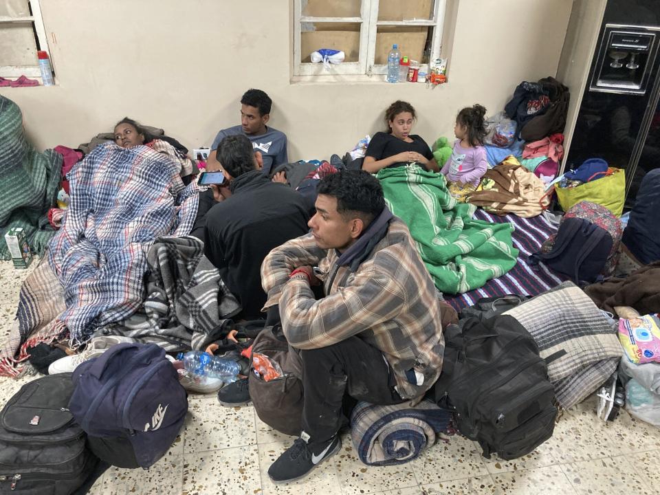 Migrants seek refuge from winter weather in a crowded shelter near the U.S. border in Ciudad Juárez, Mexico, on Thursday, Dec. 22, 2022. Hundreds of migrants are gathered in unusually frigid cold temperatures along the Mexican-U.S. border near El Paso, Texas, awaiting a U.S. Supreme Court decision on whether and when to lift pandemic-era restrictions that prevent many from seeking asylum. (AP Photo/Morgan Lee)