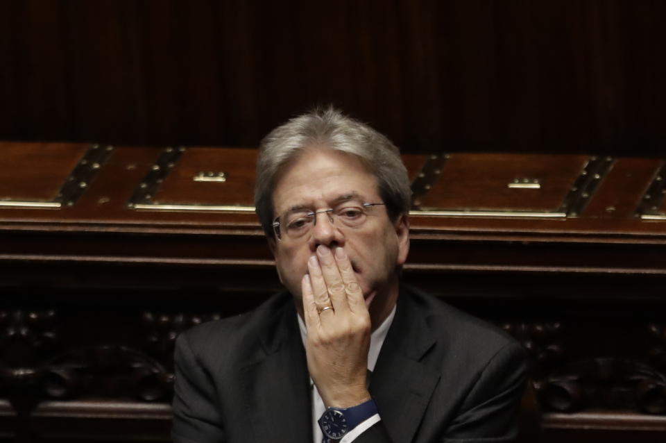 Italian Prime Minister Paolo Gentiloni sits in the parliament after giving his first speech as premier at the lower house where he will later face a confidence vote, in Rome Tuesday, Dec. 13, 2016. Paolo Gentiloni, a Democrat formerly serving as foreign minister, formed Italy’s new government Monday, keeping several key ministers from the coalition of Matteo Renzi, who resigned last week. (AP Photo/Alessandra Tarantino)