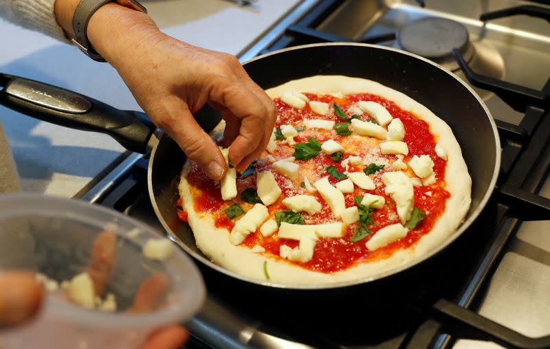 A Pizza Pilgrims, Pizza in the Post kit, is prepared prior to cooking amid the coronavirus disease (COVID-19) outbreak in London