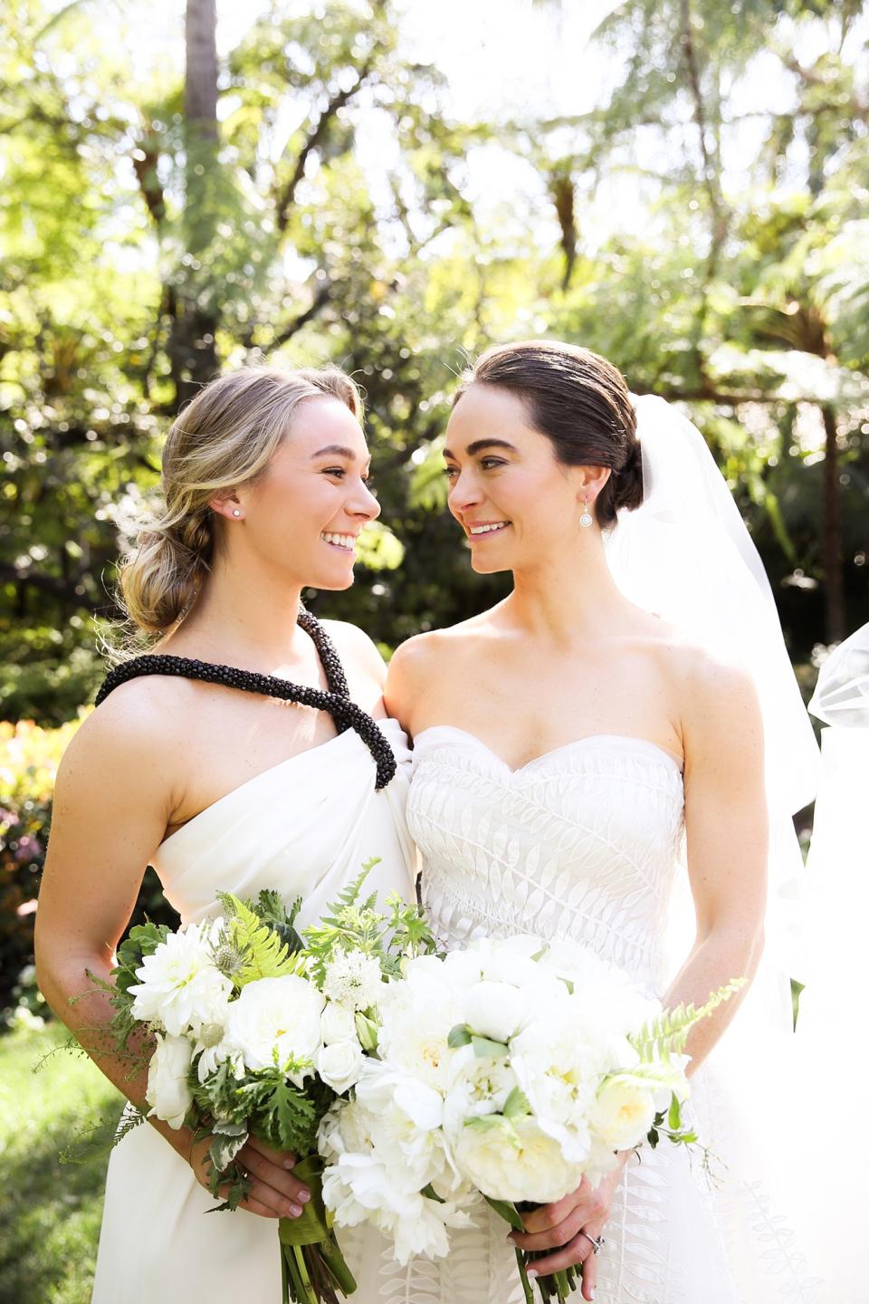 The bride wore Oscar de la Renta, inspired by her grandmother, for her greenery-filled ceremony at the Beverly Hills Hotel.