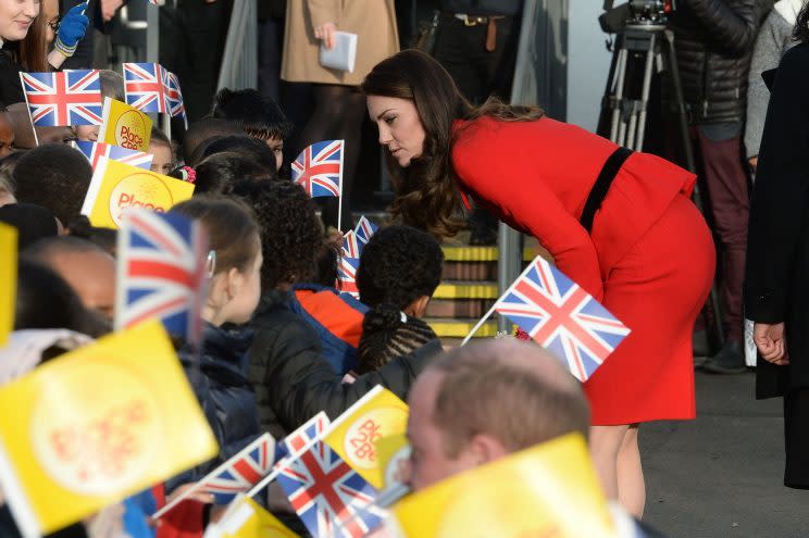 <i>Kate took time to speak to the children waiting outside [Photo: PA]</i>