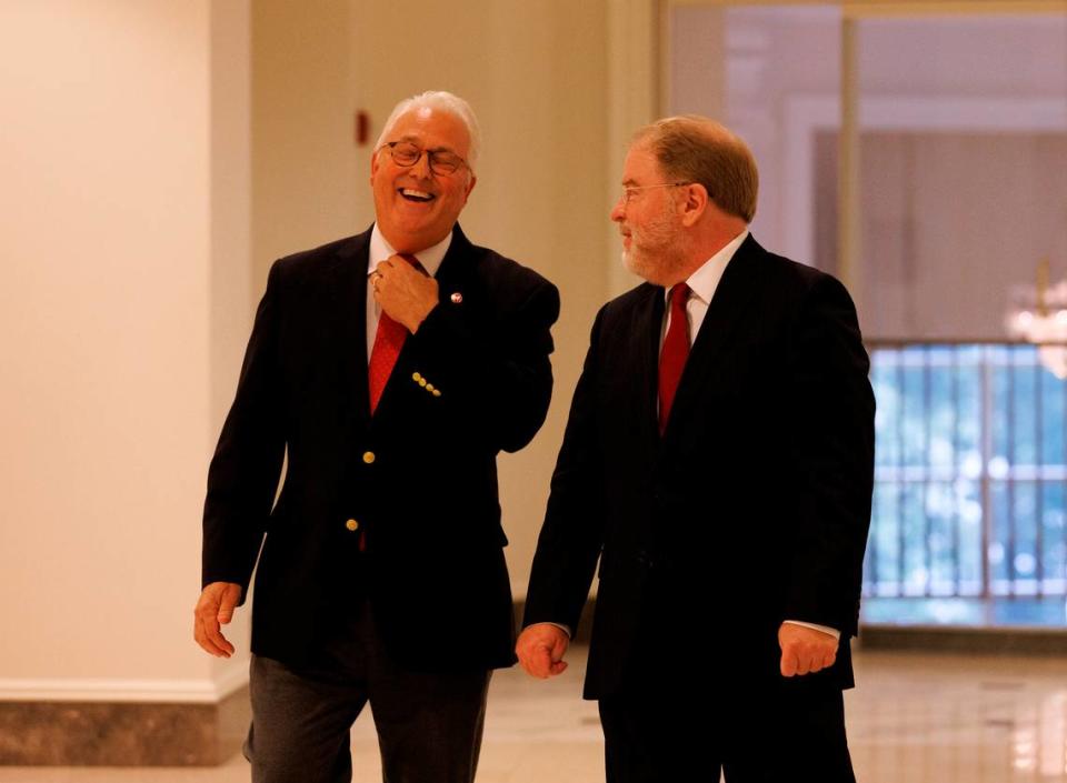N.C. State Chancellor Randy Woodson shares a laugh with UNC System President Peter Hans following a meeting of the N.C. State Board of Trustees on Thursday, July 18, 2024, in Raleigh, N.C. during which Woodson announced that he will retire next summer after a 15-year tenure leading the Wolfpack.