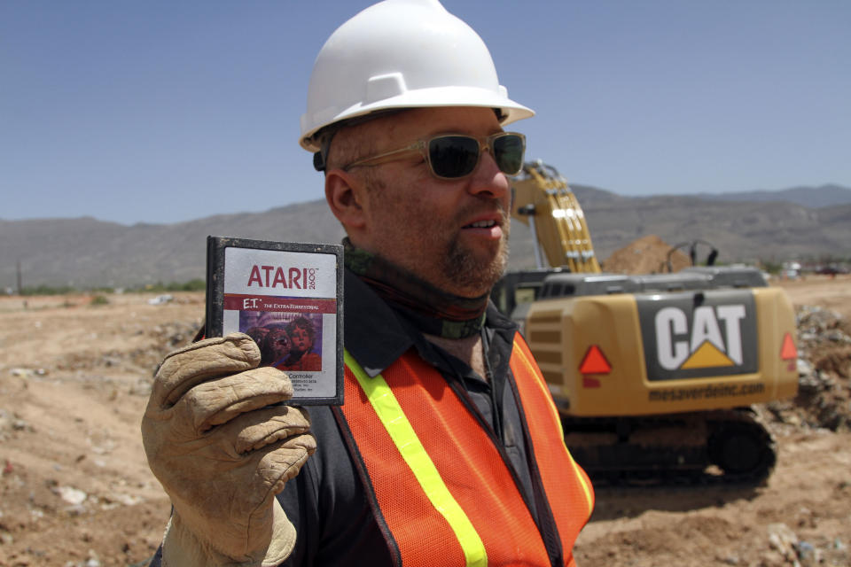 Film Director Zak Penn shows a box of a decades-old Atari 'E.T. the Extra-Terrestrial' game found in a dumpsite in Alamogordo, N.M., Saturday, April 26, 2014. Producers of a documentary dug in a southeastern New Mexico landfill in search of millions of cartridges of the game that has been called the worst game in the history of video gaming and were buried there in 1983. (AP Photo/Juan Carlos Llorca)