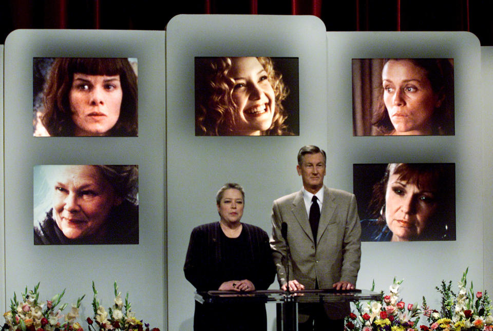 Academy of Motion Picture Arts and Sciences president Robert Rehme and Oscar winning actress Kathy Bates (L) announce the nominations for Best Supporting Actress for the 73rd annual Academy Awards during a live telecast February 13, 2001 from academy headquarters in Beverly Hills. Nominess for best supporting actress are, photographs (lower left to right) Judi Dench in 