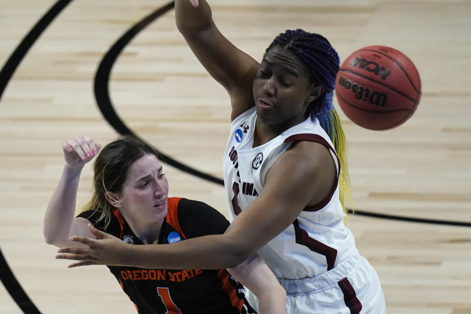 Oregon State guard Aleah Goodman, left, passes around South Carolina forward Aliyah Boston, right, during the second half of a college basketball game in the second round of the women's NCAA tournament at the Alamodome in San Antonio, Tuesday, March 23, 2021. (AP Photo/Eric Gay)