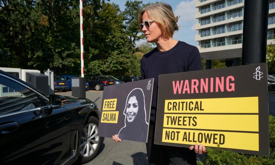 Human rights activists protest at a hotel in The Hague where Saudi Arabia was marking its statehood day with a reception in September