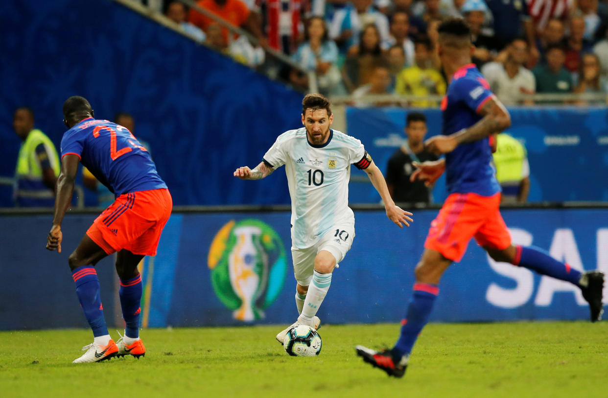 Soccer Football - Copa America Brazil 2019 - Group B - Argentina v Colombia - Arena Fonte Nova, Salvador, Brazil - June 15, 2019   Argentina's Lionel Messi in action with Colombia's Davinson Sanchez   REUTERS/Luisa Gonzalez