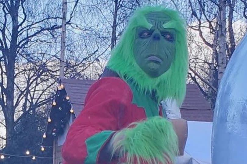 Visitors to the drive-through are greeted by a Grinch described by one parent as 'the stuff of nightmares'. (Reach)