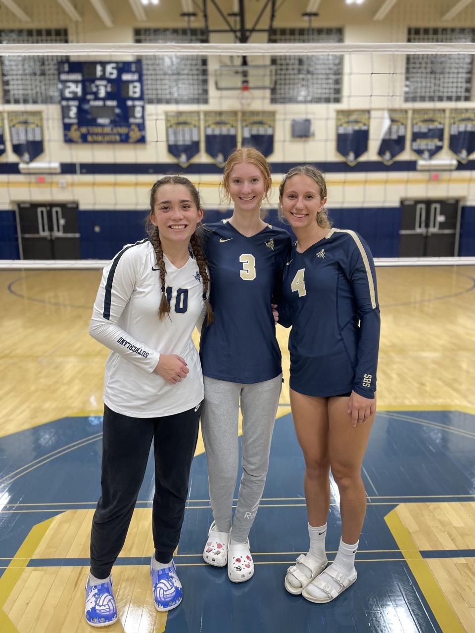 Pittsford Sutherland girls volleyball players Sophia Hanford, Lila Keating and Alana Pinto after a 3-0 win over Eastridge on Sept. 20, 2023.