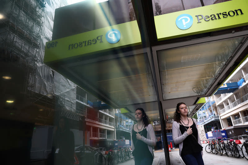 FILE PHOTO: The company logo is displayed outside the Pearson offices in London, Britain August 4, 2017. REUTERS/Neil Hall/File Photo