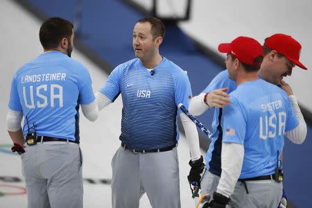 Curling - Pyeongchang 2018 Winter Olympics - Men's Round Robin - Britain v U.S. - Gangneung Curling Center - Gangneung, South Korea - February 21, 2018 - John Landsteiner, Tyler George, John Shuster and Matt Hamilton of the U.S. celebrate after defeating Britain. REUTERS/Phil Noble