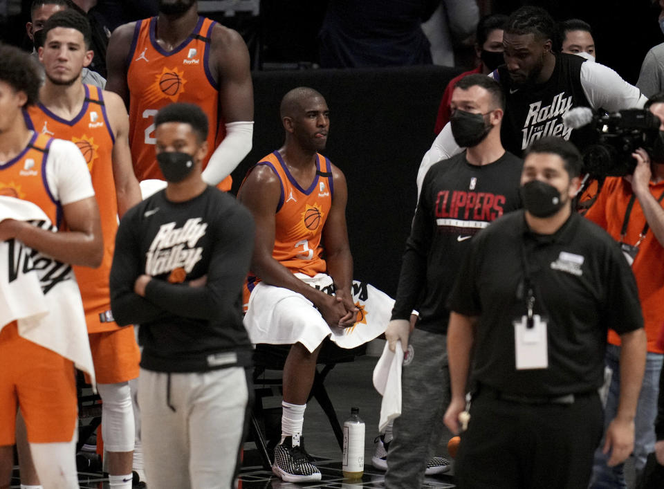 Chris Paul #3 of the Phoenix Suns sits on the bench as the LA Clippers defeated the Phoenix Suns 106-92 during game three of a Western Conference finals NBA playoff basketball game at the Staples Center in Los Angeles on Thursday, June 24, 2021. (Keith Birmingham/The Orange County Register via AP)