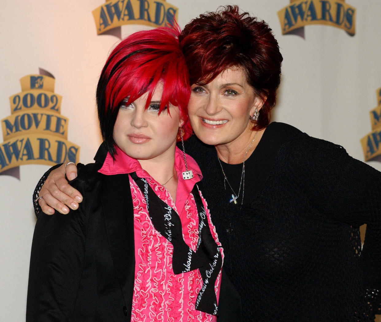 Kelly Osbourne and Mum Sharon Osbourne pose for photographers back stage at the 2002 MTV Movie Awards at the Shrine Auditorium, Los Angeles.