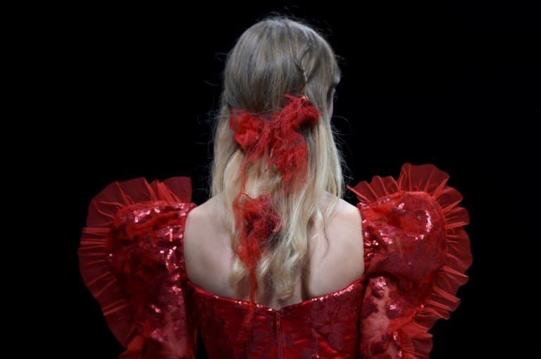 A model displays fashions during the Rodarte Spring-Summer 2017 Runway show at New York Fashion Week in New York on September 13, 2016