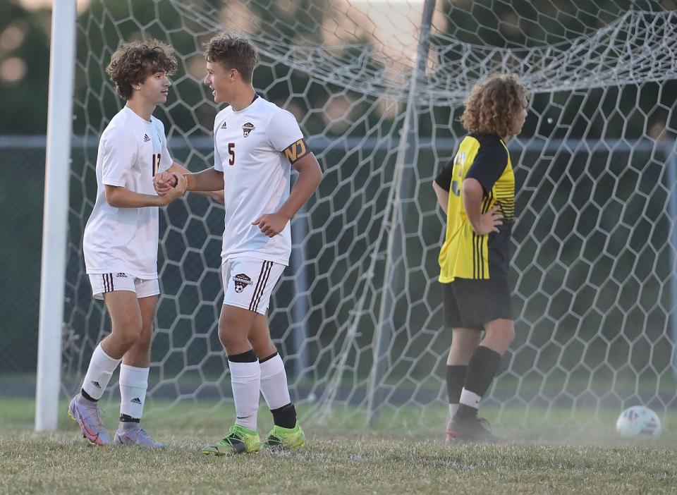 Walsh Jesuit's Brady Catanzarite, left, congratulates teammate Xavier Munro after his second half goal against Cuyahoga Falls on Thursday, Sept. 1, 2022 in Cuyahoga Falls, Ohio, at Laybourne Field.