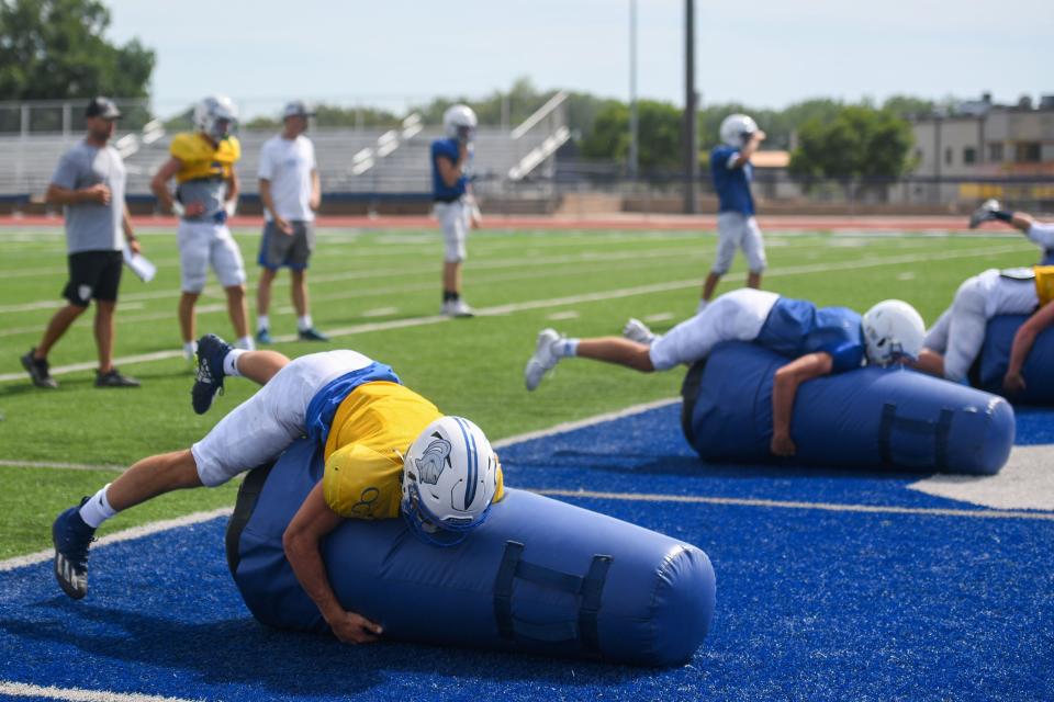 Players practice tackling at O'Gorman High School in Sioux Falls, South Dakota on Wednesday, August 16, 2023.