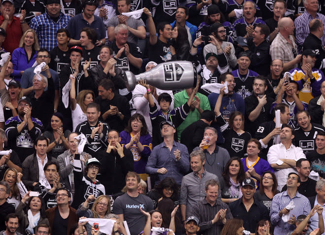 LOS ANGELES, CA - JUNE 11: A young Los Angeles Kings fan holds up a replica of the Stanley Cup during Game Six of the 2012 Stanley Cup Final at Staples Center on June 11, 2012 in Los Angeles, California. (Photo by Christian Petersen/Getty Images)