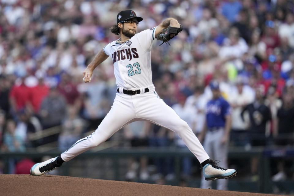 Arizona Diamondbacks starting pitcher Zac Gallen throws against the Texas Rangers during the first inning in Game 5 of the baseball World Series Wednesday, Nov. 1, 2023, in Phoenix. (AP Photo/Godofredo A. Vásquez)