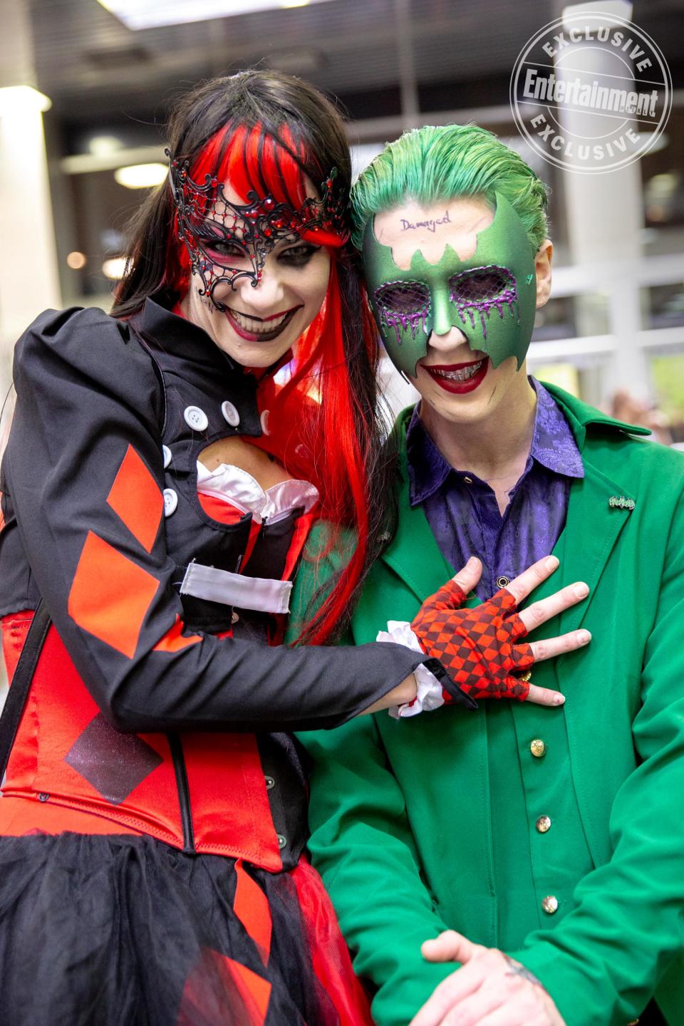 Masquerade Harley Quinn and Joker cosplayers