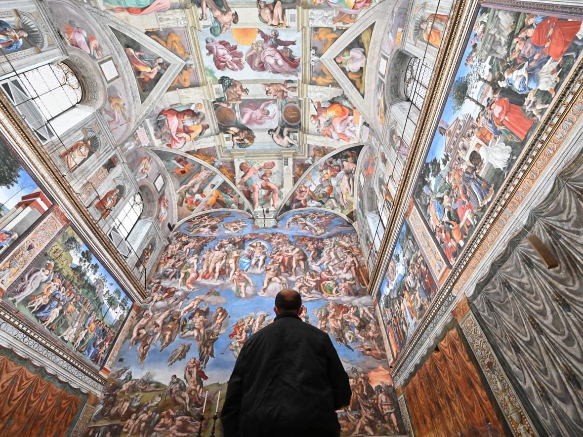 A man visits the Sistine Chapel on Feb. 1, 2021 in Vatican City. (Andreas Solaro/AFP via Getty Images - image credit)