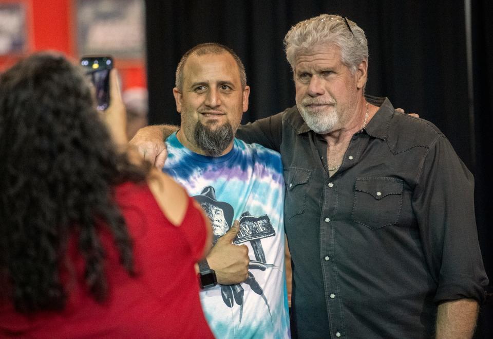 Drew Gaddoni of Stockton, left, poses for a picture with actor Ron Perlman at the annual StocktonCon at the Stockton Arena in downtown Stockton on Saturday, August, 13, 2022.  
